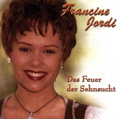 Francine Jordis Cover ihres ersten Albums „Das Feuer der Sehnsucht“ aus dem Jahr 1998. Im selben Jahr gewann die Sängerin den „Grand Prix der Volksmusik“ mit dem gleichnamigen Titel. 