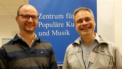  Rechts: Dr. Dr. Michael Fischer, geschäftsführender Direktor des Zentrums für populäre Kultur und Musik an der Universität Freiburg; Links: Dr. Johannes Müske